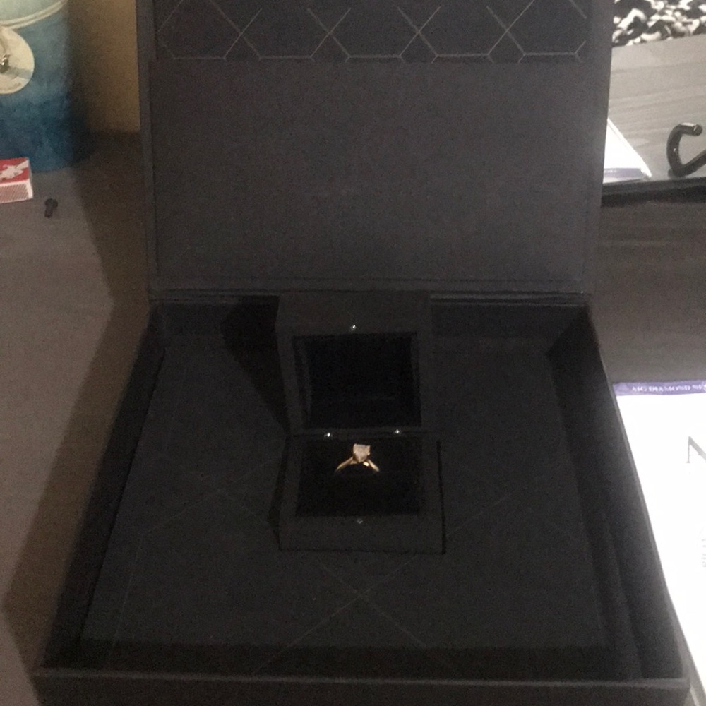 1.59 Karat 24K gold Asscher cut engagement ring.